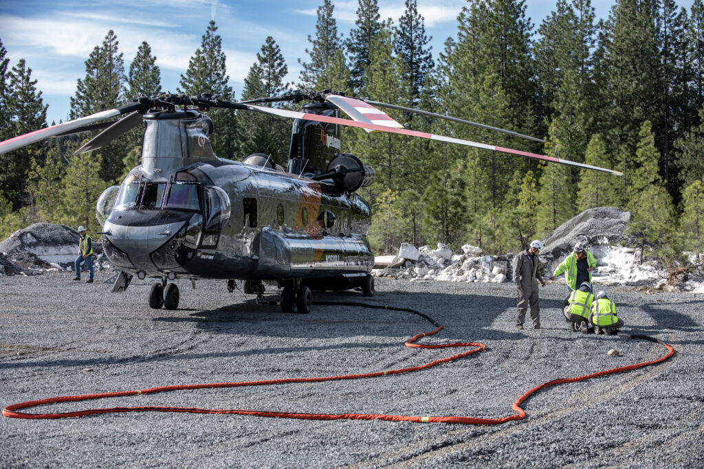 Crews rig a Chinook CH-47 Helicopter