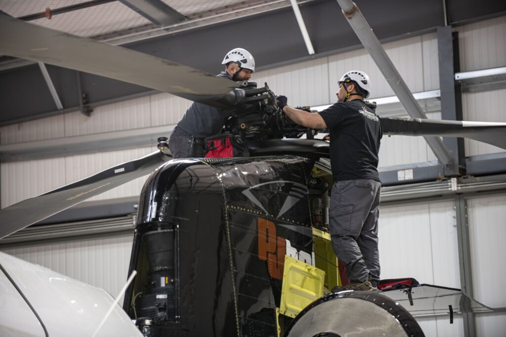 Mechanics works on a CH-47D Chinook helicopter